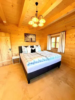 Ein Bett oder Betten in einem Zimmer der Unterkunft Ferienhaus Seerose