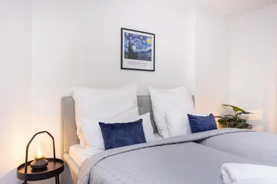 Ein Bett oder Betten in einem Zimmer der Unterkunft LaDolceVita - 100m2 Apartment in Zentraler Lage
