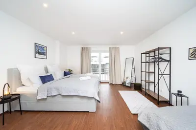 Ein Bett oder Betten in einem Zimmer der Unterkunft LaDolceVita - 100m2 Apartment in Zentraler Lage