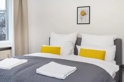 Ein Bett oder Betten in einem Zimmer der Unterkunft LaDolceVita - 100m2 Apartment in Zentraler Lage