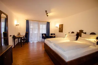 Ein Bett oder Betten in einem Zimmer der Unterkunft s`Wirtshaus Hotel & Restaurant