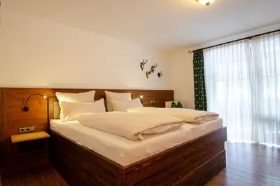 Ein Bett oder Betten in einem Zimmer der Unterkunft s`Wirtshaus Hotel & Restaurant
