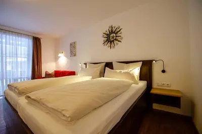Ein Bett oder Betten in einem Zimmer der Unterkunft s`Wirtshaus Hotel & Restaurant