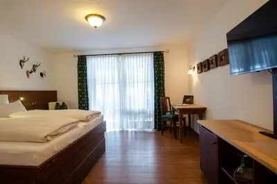 Ein Bett oder Betten in einem Zimmer der Unterkunft s`Wirtshaus Hotel & Restaurant