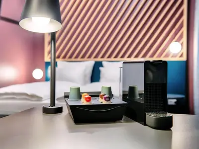 Ein Bett oder Betten in einem Zimmer der Unterkunft B&B Hotel München-Trudering