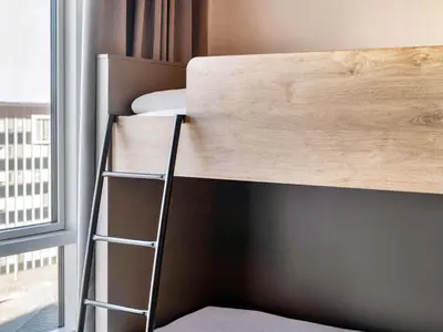 Ein Bett oder Betten in einem Zimmer der Unterkunft B&B Hotel München-Trudering