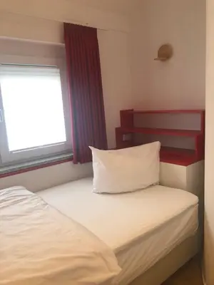 Ein Bett oder Betten in einem Zimmer der Unterkunft Baumann Suiten