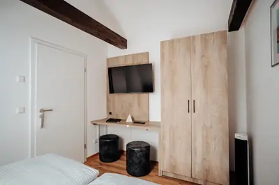 Ein Bett oder Betten in einem Zimmer der Unterkunft Boardinghouse Victory