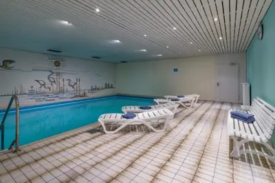 Der Swimmingpool an oder in der Nähe von Chiemgau Comfort D4 Ferienwohnanlage Oberaudorf mit Hallenbad und Sauna