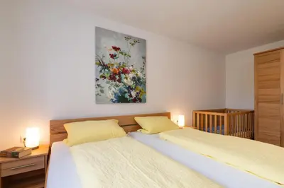 Ein Bett oder Betten in einem Zimmer der Unterkunft Ferienwohnungen Maderhof