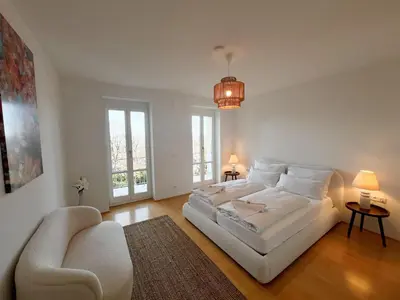 Ein Bett oder Betten in einem Zimmer der Unterkunft LIBORIA I Villa mit Seeblick 10min vom See