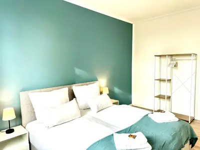 Ein Bett oder Betten in einem Zimmer der Unterkunft UNiQE - city central - design apartment - SKY-TV - free parking