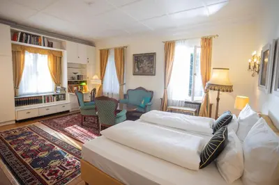 Ein Bett oder Betten in einem Zimmer der Unterkunft Gästehaus Englischer Garten