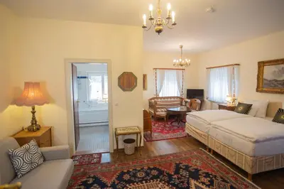 Ein Bett oder Betten in einem Zimmer der Unterkunft Gästehaus Englischer Garten