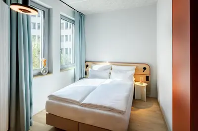 Ein Bett oder Betten in einem Zimmer der Unterkunft DEIN APART München