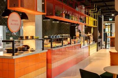 Ein Restaurant oder anderes Speiselokal in der Unterkunft DEIN APART München