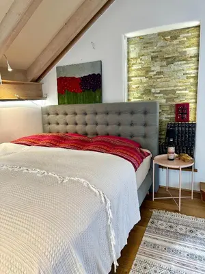 Ein Bett oder Betten in einem Zimmer der Unterkunft La Vie en rose