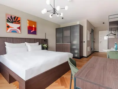 Ein Bett oder Betten in einem Zimmer der Unterkunft Numa Munich Obersendling