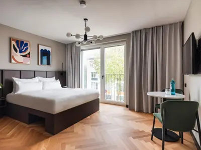 Ein Bett oder Betten in einem Zimmer der Unterkunft Numa Munich Obersendling