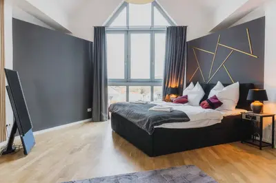 Ein Bett oder Betten in einem Zimmer der Unterkunft Luxury 4 Bedroom Apartment/Therme Erding/Parking