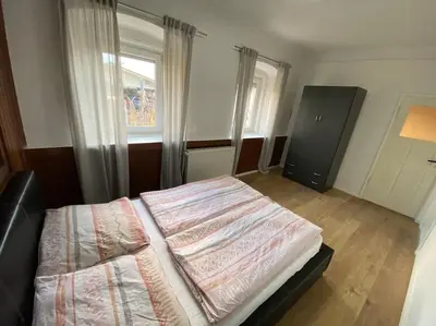 Ein Bett oder Betten in einem Zimmer der Unterkunft Gemütliche Wohnung in Oberbayern