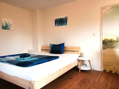 Ein Bett oder Betten in einem Zimmer der Unterkunft InnBlick Ferienwohnungen