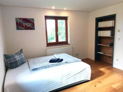 Ein Bett oder Betten in einem Zimmer der Unterkunft InnBlick Ferienwohnungen