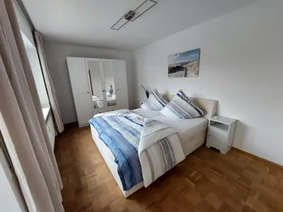 Ein Bett oder Betten in einem Zimmer der Unterkunft FeWo Ruhepo(o)l inkl. Sauna