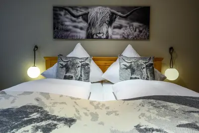 Ein Bett oder Betten in einem Zimmer der Unterkunft Alpenluft II