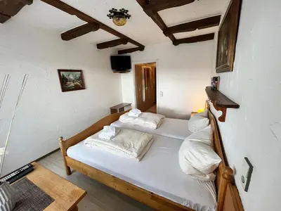 Ein Bett oder Betten in einem Zimmer der Unterkunft Hotel Negele