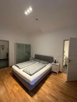 Ein Bett oder Betten in einem Zimmer der Unterkunft Al Nafurah Apartments