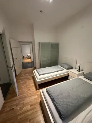 Ein Bett oder Betten in einem Zimmer der Unterkunft Al Nafurah Apartments