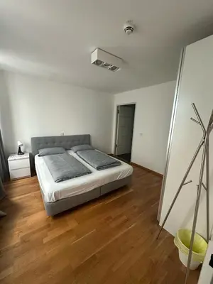 Ein Bett oder Betten in einem Zimmer der Unterkunft Al Nafurah Apartments