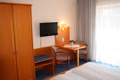 Ein Bett oder Betten in einem Zimmer der Unterkunft Burghotel Aschau