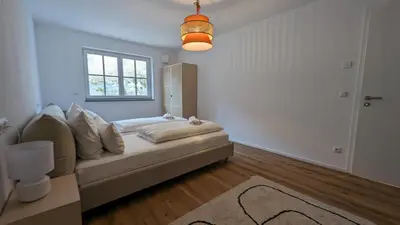 Ein Bett oder Betten in einem Zimmer der Unterkunft LiBORIA I Als Gruppe am Riegsee