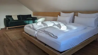 Ein Bett oder Betten in einem Zimmer der Unterkunft LiBORIA I Als Gruppe am Riegsee