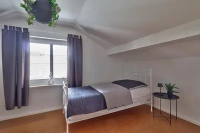 Ein Bett oder Betten in einem Zimmer der Unterkunft Bezaubernde Ferienwohnung nahe des Kloster Andechs