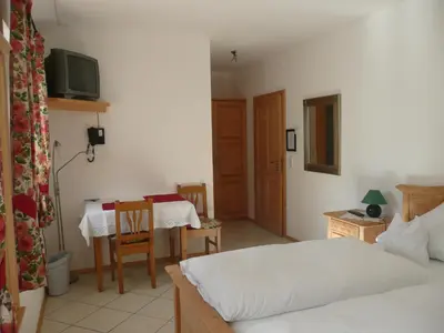 Ein Bett oder Betten in einem Zimmer der Unterkunft Landhaus Caesar - Hotel Garni