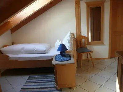 Ein Bett oder Betten in einem Zimmer der Unterkunft Landhaus Caesar - Hotel Garni