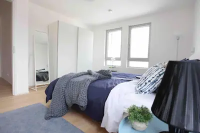 Ein Bett oder Betten in einem Zimmer der Unterkunft Auszeit Herrsching - 3 Zimmer Wohnung in See Nähe