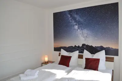 Ein Bett oder Betten in einem Zimmer der Unterkunft Alpenperle