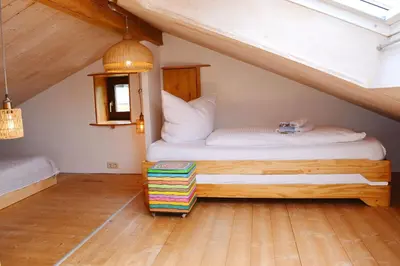 Ein Bett oder Betten in einem Zimmer der Unterkunft Schneckenhaus