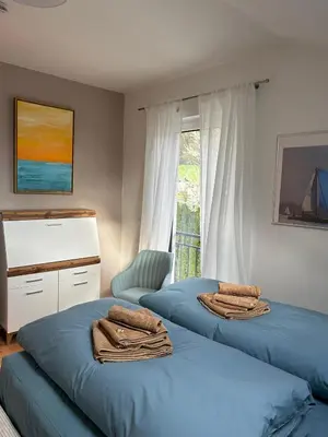 Ein Bett oder Betten in einem Zimmer der Unterkunft Ferienhaus Baron mit eigener Sauna