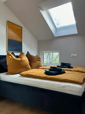 Ein Bett oder Betten in einem Zimmer der Unterkunft Ferienhaus Baron mit eigener Sauna