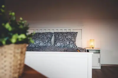 Ein Bett oder Betten in einem Zimmer der Unterkunft Kinsau Rooms