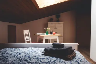 Ein Bett oder Betten in einem Zimmer der Unterkunft Kinsau Rooms
