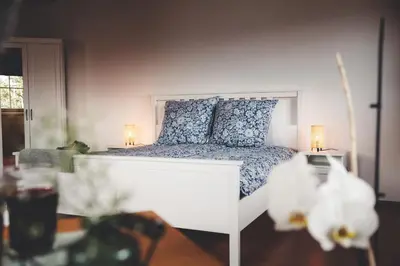 Ein Bett oder Betten in einem Zimmer der Unterkunft Kinsau Rooms