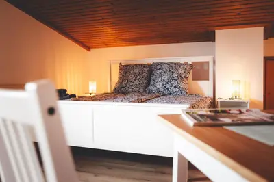 Ein Bett oder Betten in einem Zimmer der Unterkunft Kinsau Rooms