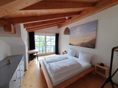 Ein Bett oder Betten in einem Zimmer der Unterkunft Fewo Kaminfeuer Aschau im Chiemgau