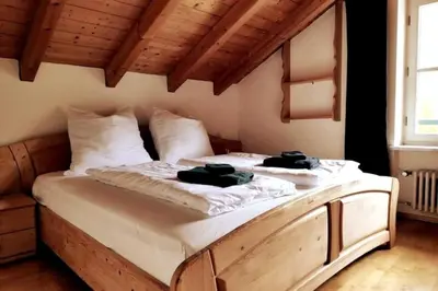 Ein Bett oder Betten in einem Zimmer der Unterkunft Fewo Kaminfeuer Aschau im Chiemgau